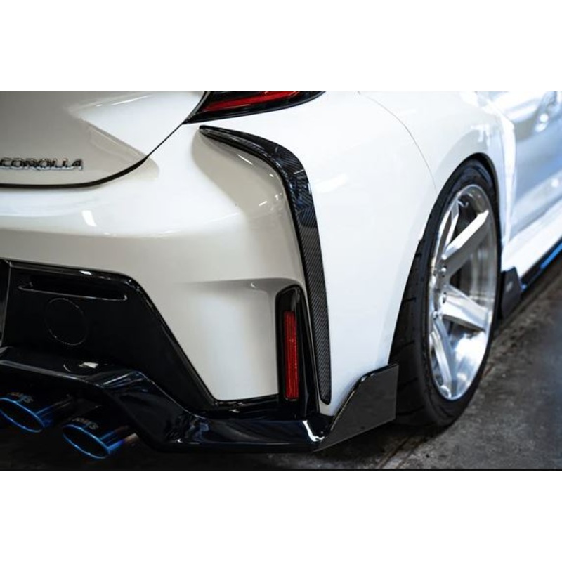 Tom's Racing Carbon Fiber Rear Bumper Garnish - Toyota GR Corolla (2023+)